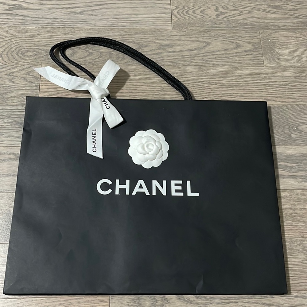 Chanel paper bag with ribbon and flower